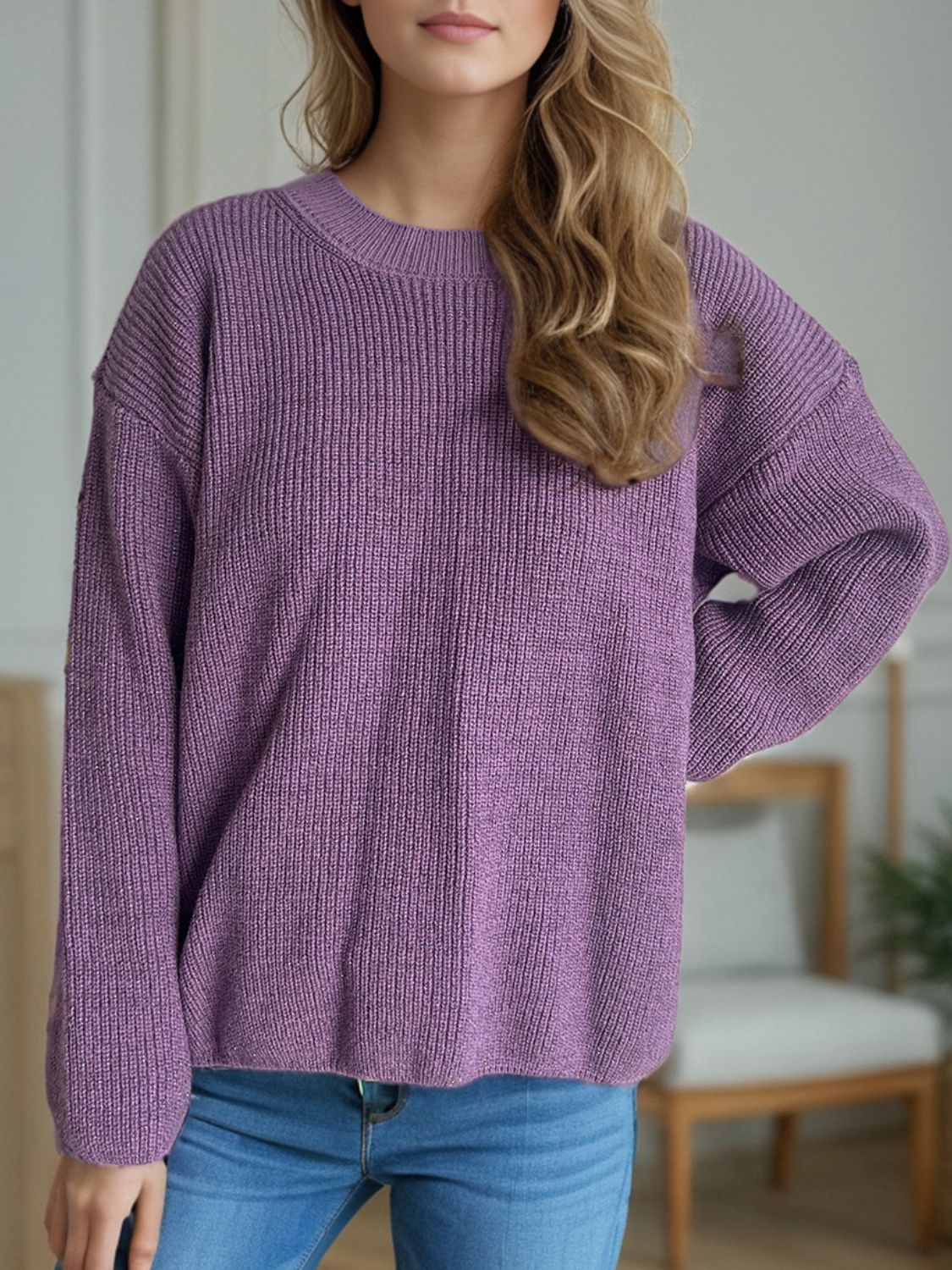 Textured ribbed knit oversized sweater in mauve with crew neck and long sleeves.