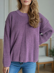 Textured ribbed knit oversized sweater in mauve with crew neck and long sleeves.