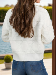 White textured knit bomber jacket with a diamond pattern and ribbed hem.