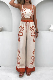 Floral print linen co-ord set with crop top and wide leg pants in ochre.