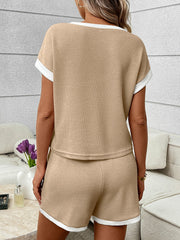 Khaki ribbed knit two-piece set with white trim, featuring short sleeves and shorts.