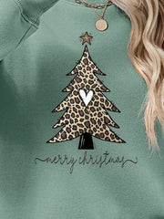 Sage green sweatshirt with leopard print Christmas tree graphic and Merry Christmas text