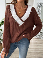 Brown ribbed knit V-neck sweater with white stripe detail and pearl buttons.