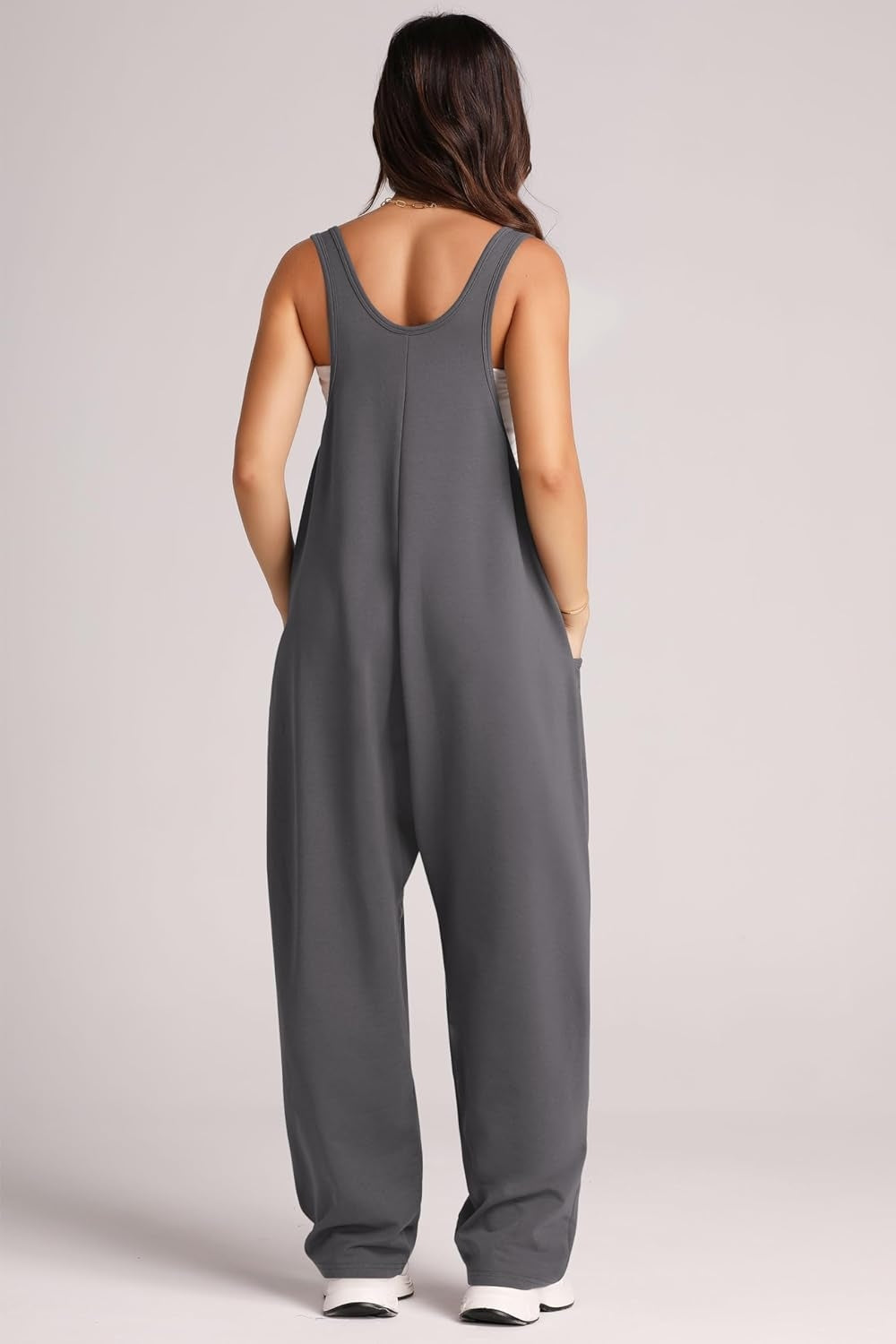 Relaxed fit gray jumpsuit with oversized pockets and scoop neckline.