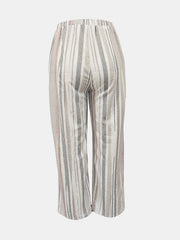 Relaxed-fit trousers in Dust Storm with vertical metallic stripes and an elastic waistband.