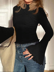 Black lettuce edge flare sleeve t-shirt with mock neck and ribbed texture.