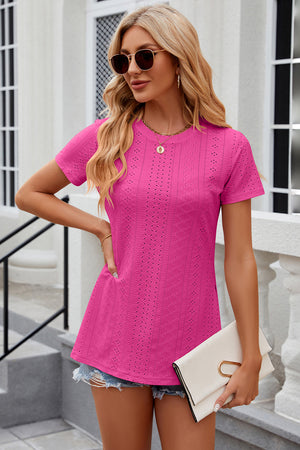 Hot Pink crewneck top with allover eyelet pattern and short sleeves.