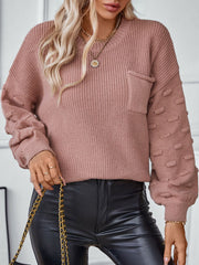 Dusty pink knit sweater with textured sleeve detail and chest pocket.