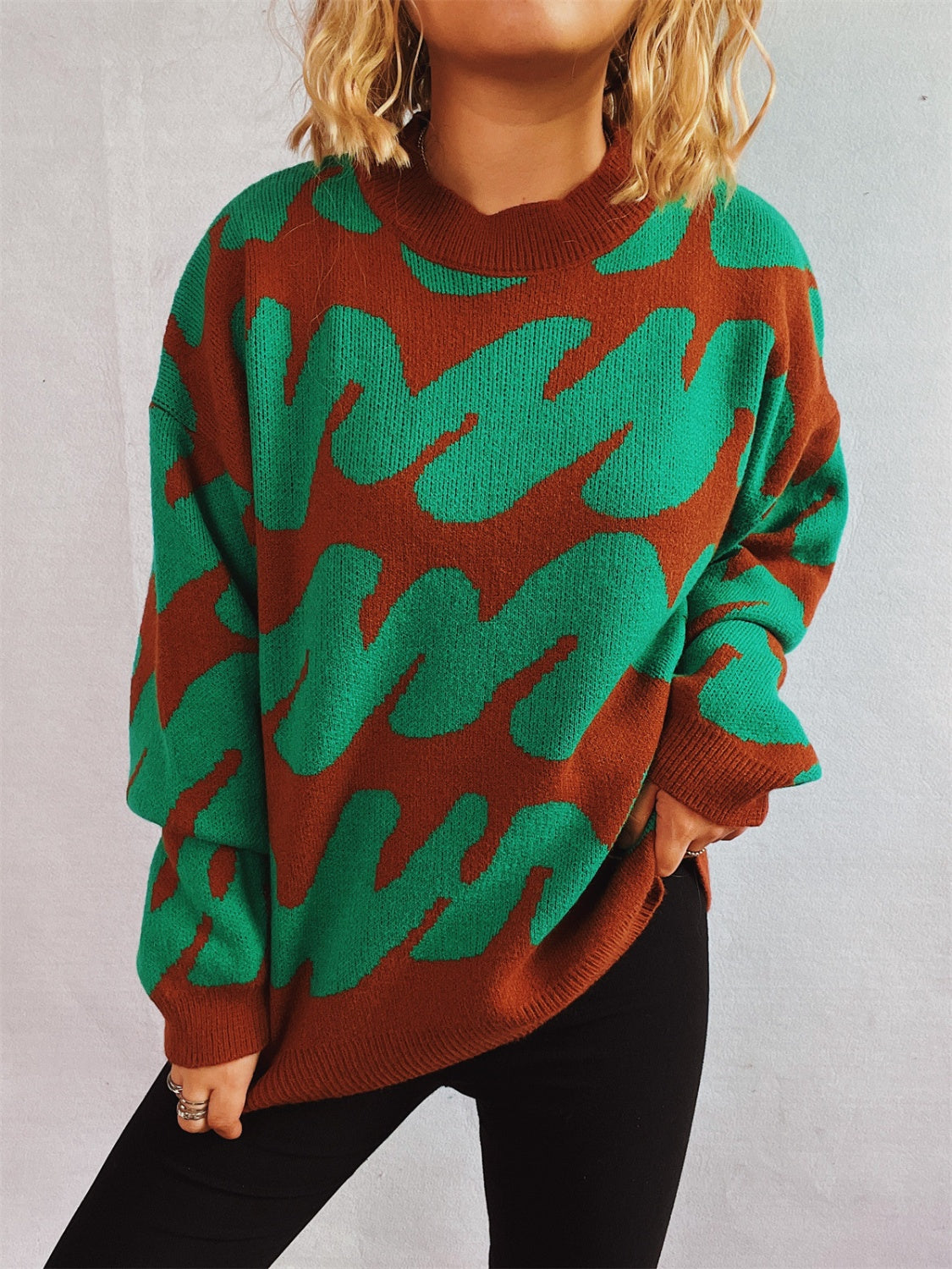 Graphic Wave Knit Sweater in dark brown and dark green with a crew neck and long sleeves.