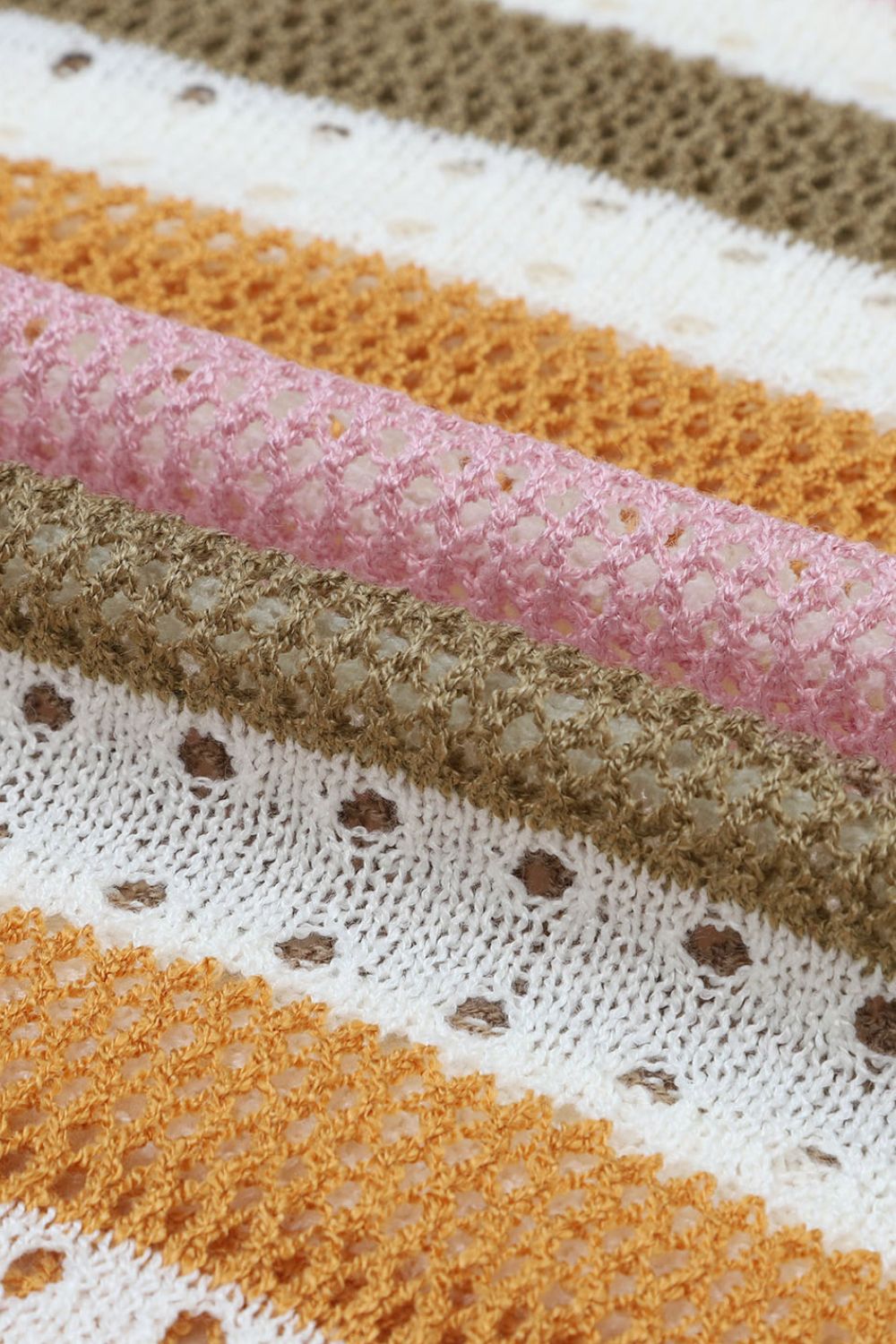 Openwork stripe crewneck sweater in acrylic with white, pink, tan, and orange stripes.