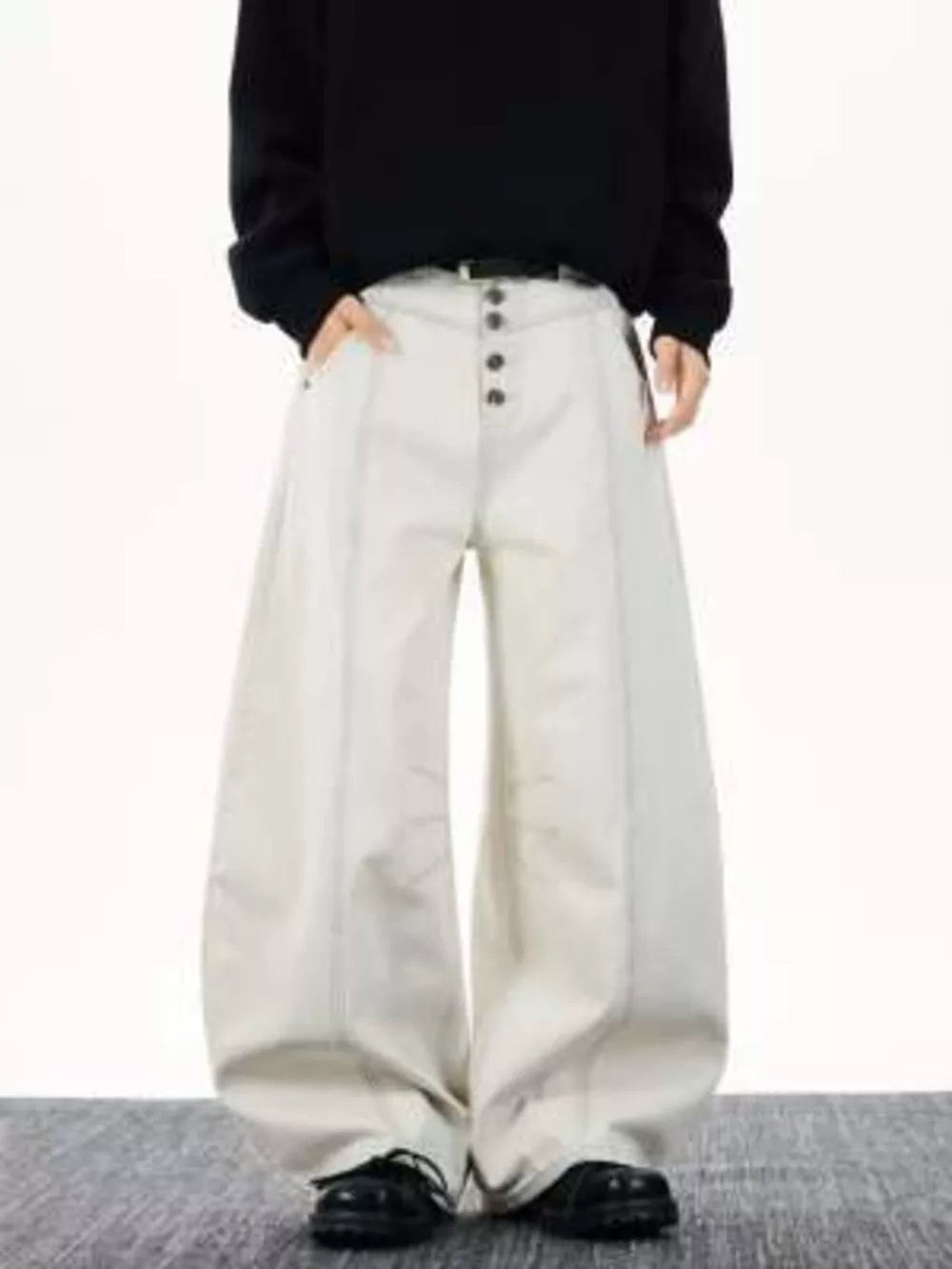 Relaxed fit wide leg button-fly jeans in off-white cotton with front seams.