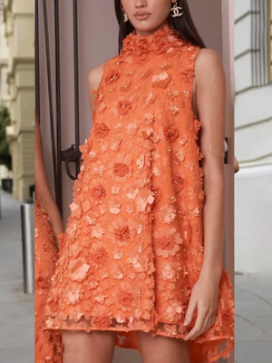 Orange ruffled floral applique mini dress with a high neckline and sleeveless design.