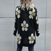 Black intarsia knit cardigan with white daisy smiley face pattern