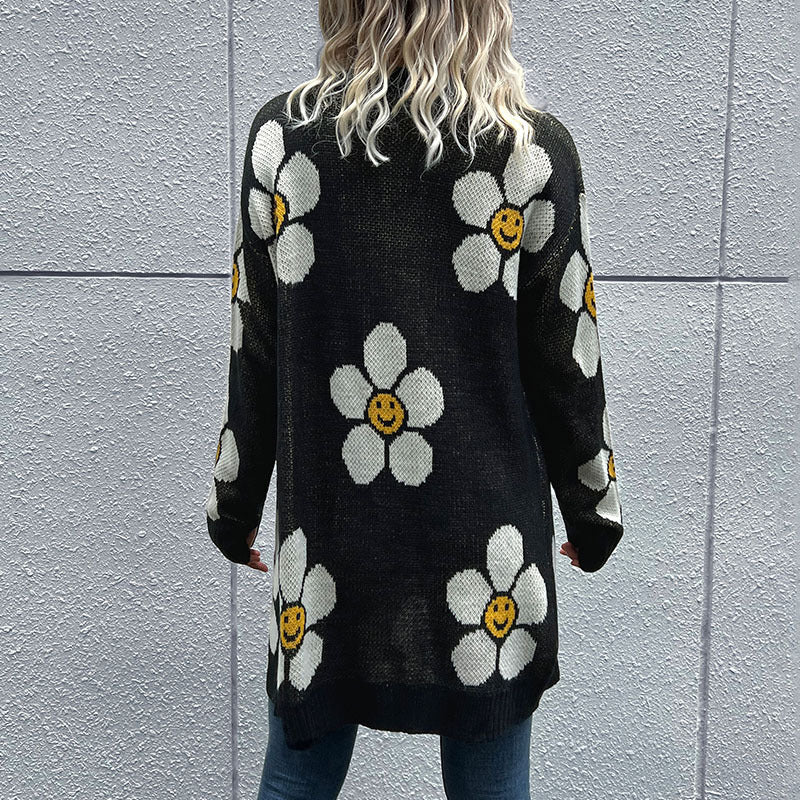 Black intarsia knit cardigan with white daisy smiley face pattern
