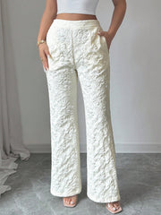 Textured high-waist wide-leg maternity pants with pockets in cream.