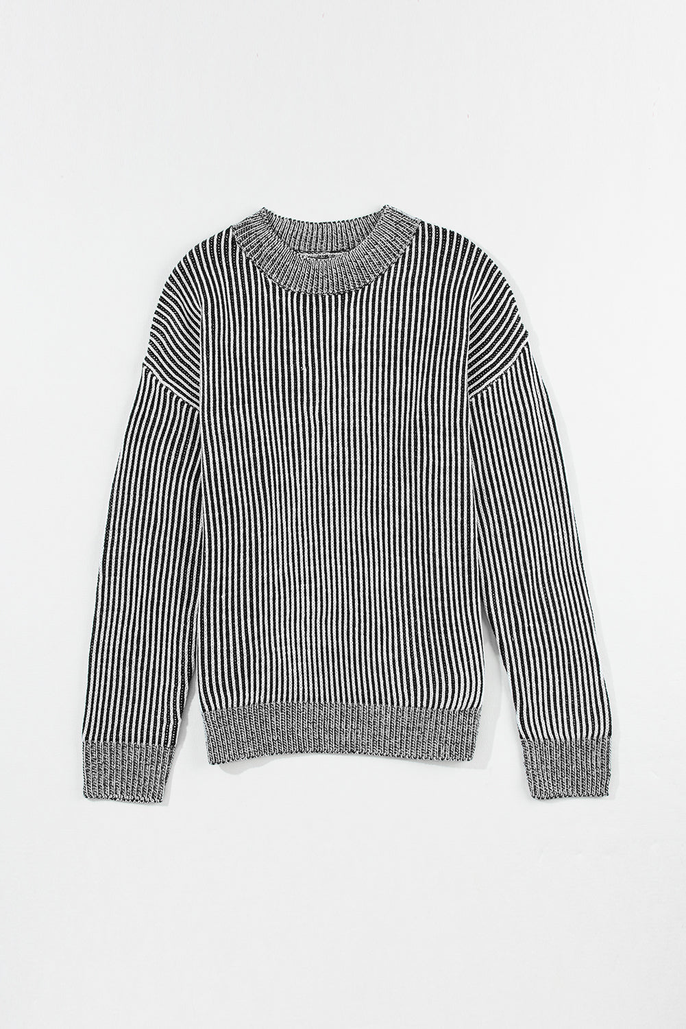 Black and white vertical ribbed mock neck pullover sweater with grey ribbed cuffs and hem.