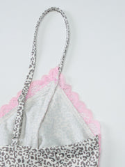 Leopard print camisole with pink lace trim and adjustable straps.