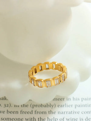 Gold baguette eternity ring with clear stones