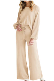 Tan loungewear set with crewneck, balloon sleeves, wide-leg pants, and drawstring waist.