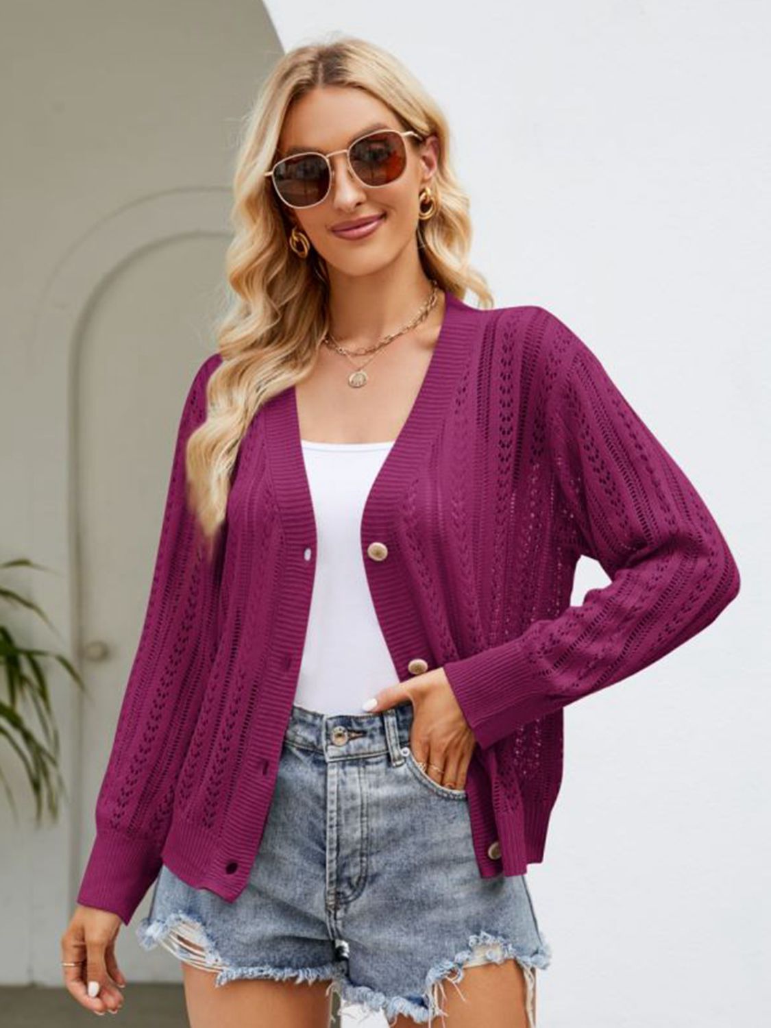 Deep purple open knit button cardigan with ribbed trim and gold buttons.
