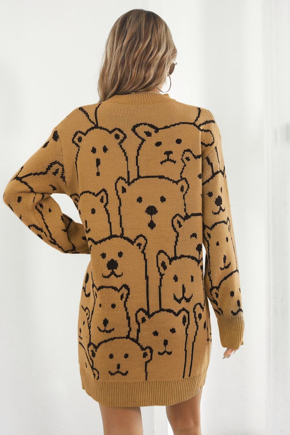 Caramel knit dress with allover black bear motif, crew neck, long sleeves.