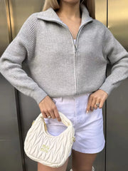 Gray ribbed knit zipper cardigan with a stand-up collar and silver zipper detail.