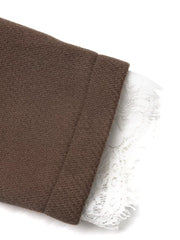 Brown blazer with white lace trim detail on the cuff.