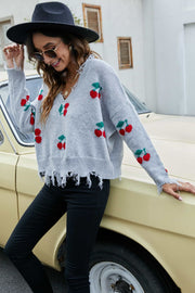 Gray V-neck sweater with cherry motif and frayed hem