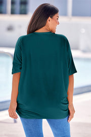 Dark Green ribbed batwing cardigan with short sleeves and a draped front detail.
