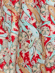 Chic floral midi dress in red with paisley pattern and spaghetti straps.