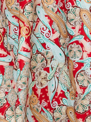Chic floral midi dress in red with paisley pattern and spaghetti straps.