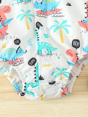 White cotton baby bodysuit with colorful dinosaur print, palm trees, and speech bubbles.