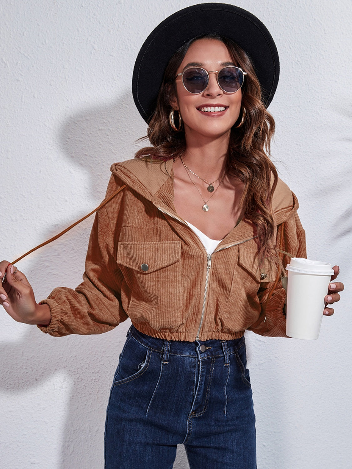 Cropped caramel corduroy hooded jacket with zip front and chest pockets.