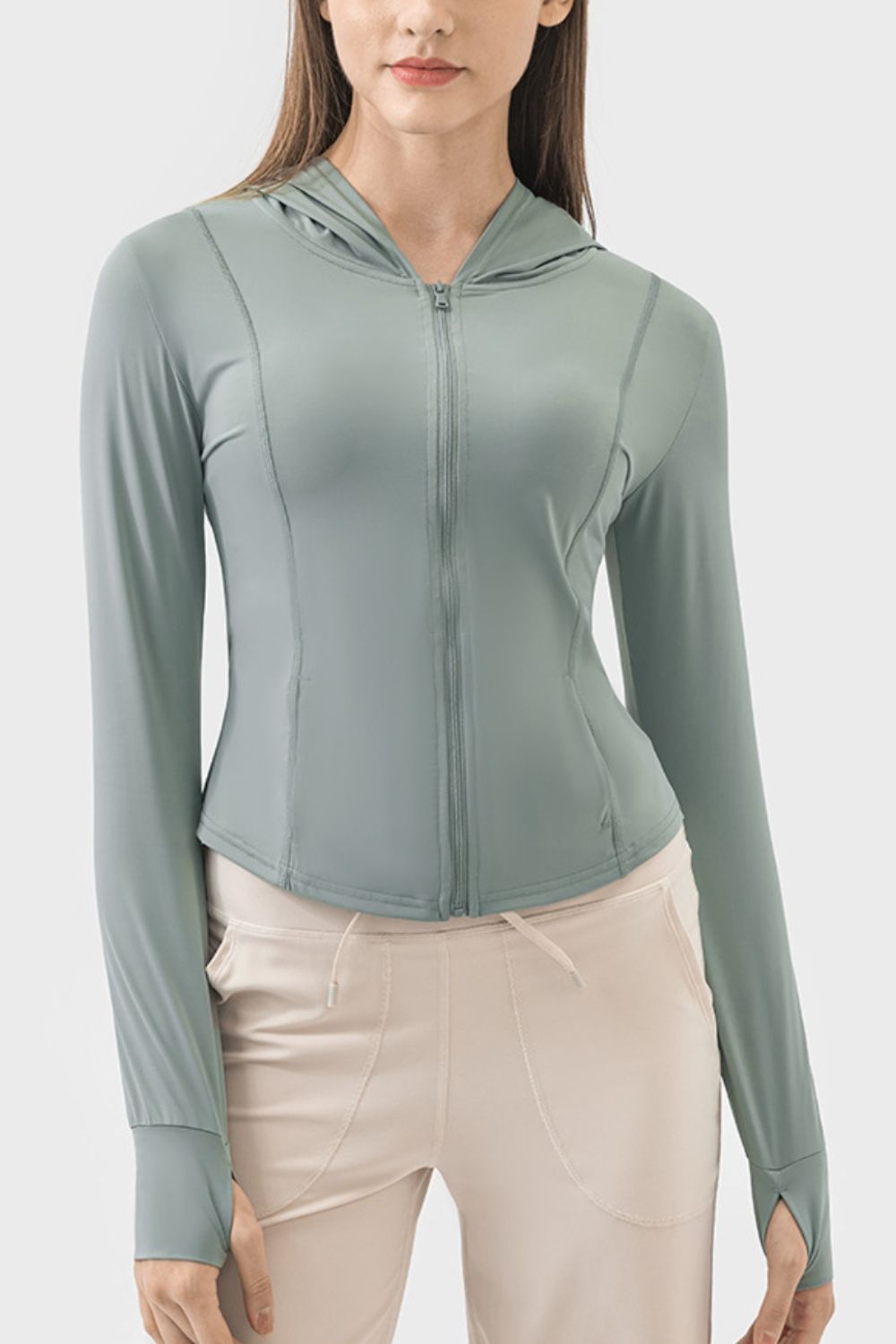 Teal activewear hoodie with thumbholes and a zipper front.