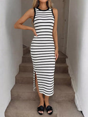 Sleek black and white striped bodycon midi dress with a side slit and crew neck.