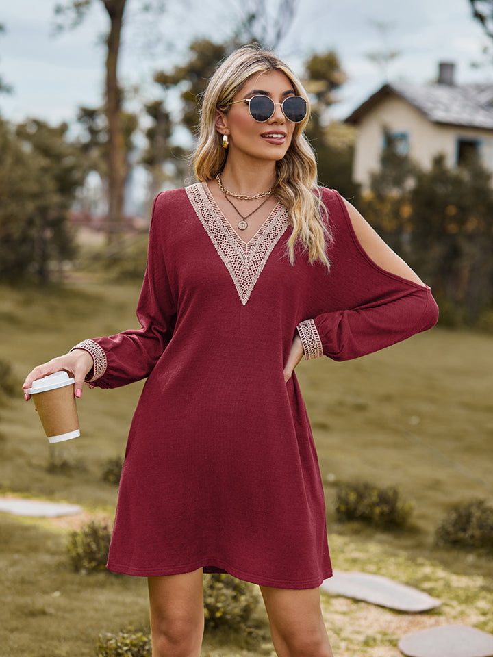 Wine cold shoulder mini dress with lace trim neckline and cuffs.