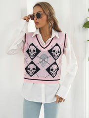 Pink argyle knit vest with black skull motif and V-neck.