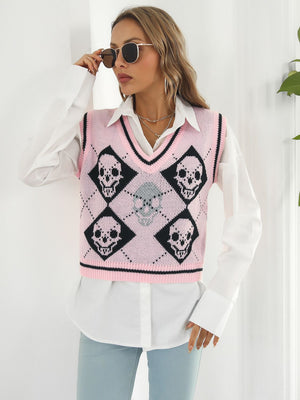 Pink argyle knit vest with black skull motif and V-neck.