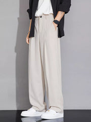 Beige wide-leg men's chinos with a relaxed fit and button closure.