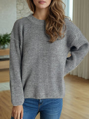Textured ribbed knit oversized sweater in gray with crewneck and long sleeves.