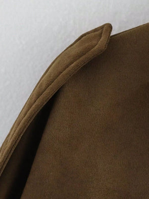 Brown oversized zip-up jacket with a textured fabric and folded collar detail.