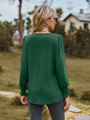 Green gathered yoke peplum sleeve top with smocked cuffs