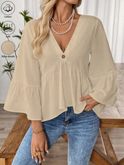 Apricot cotton V-neck bell sleeve blouse with tiered hem and button detail