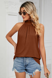 Brown halter neck blouse with gathered neckline and sleeveless cut