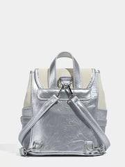 Charming mini heart flap backpack in silver and cream with adjustable straps.