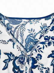 Charming floral midi dress with drawstring waist in dark blue, featuring a button-down neckline.