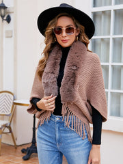 Textured knit poncho in Khaki with faux fur collar and fringe detail.