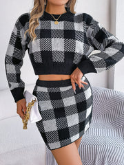 Black and white checkered cropped knit sweater and mini skirt set with long sleeves.
