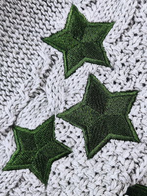 Gray cable knit cardigan with embroidered green stars detail