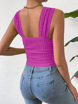 Textured crinkle strap crop top in magenta with ruched detail.